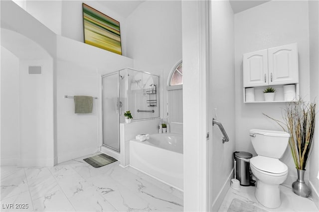 9155 Bush Poppy Ave, Las Vegas, NV 89147 - bathroom featuring marble finish flooring, a garden tub, a stall shower, toilet, and baseboards