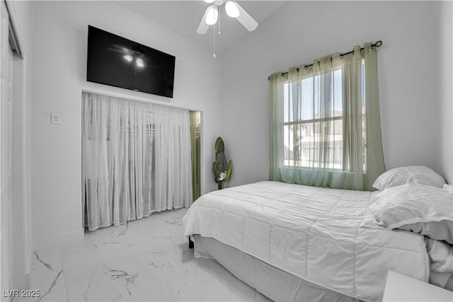 9155 Bush Poppy Ave, Las Vegas, NV 89147 - bedroom featuring vaulted ceiling, marble look tile flooring, and a ceiling fan
