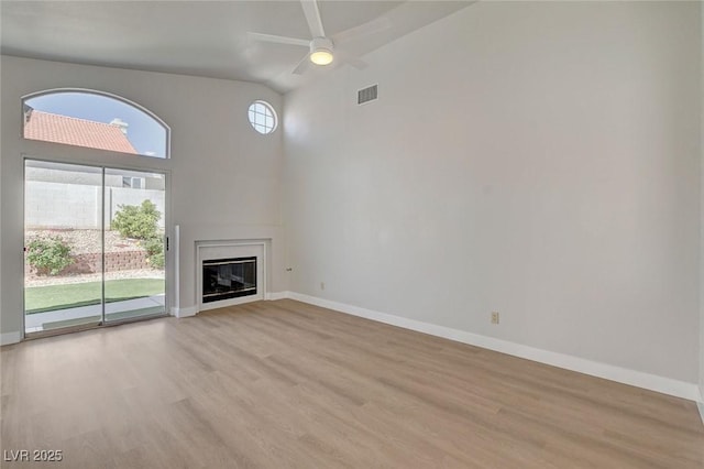 unfurnished living room with visible vents, baseboards, and light wood-style flooring