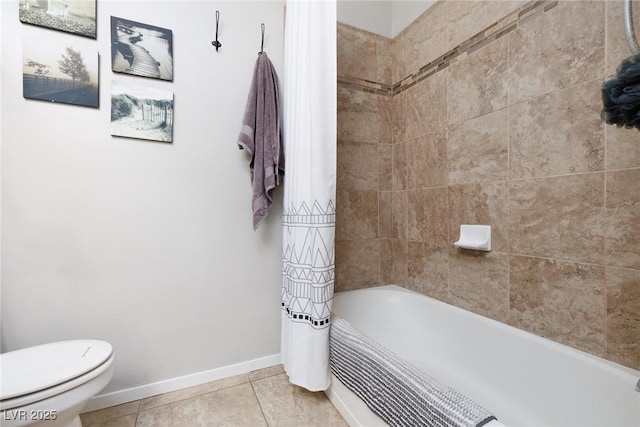 bathroom featuring shower / bath combo, toilet, tile patterned flooring, and baseboards