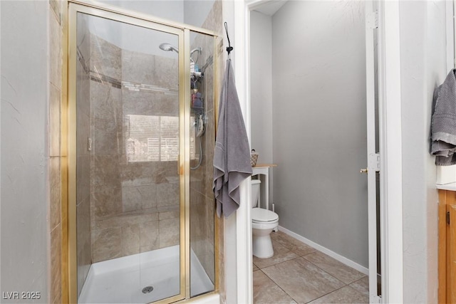 full bathroom with toilet, a shower stall, and tile patterned flooring