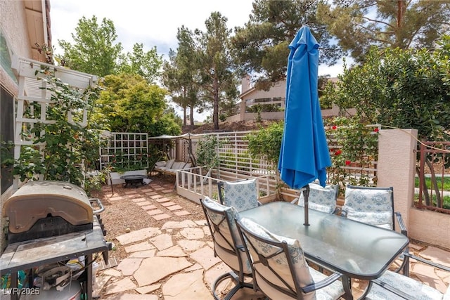 view of patio featuring a grill and outdoor dining area
