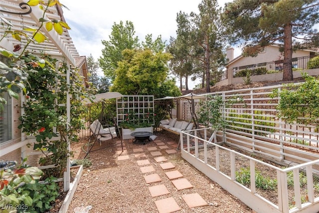 view of patio with a fire pit and a fenced backyard