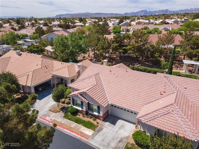 drone / aerial view with a mountain view and a residential view