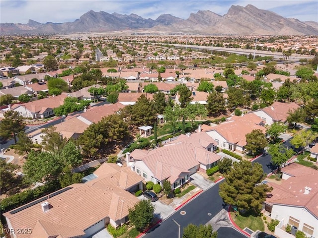 birds eye view of property with a residential view and a mountain view
