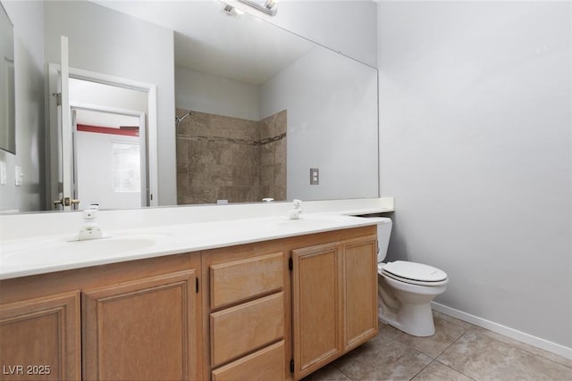 1709 Pacific Panorama Pl, Las Vegas, NV 89144 - bathroom with double vanity, toilet, a tile shower, and tile patterned flooring