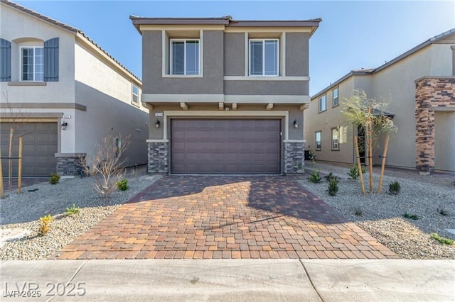 traditional-style home with stucco siding, stone siding, decorative driveway, and an attached garage