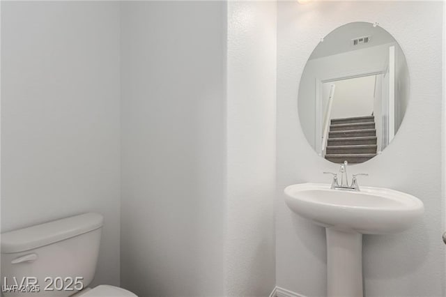 bathroom featuring toilet