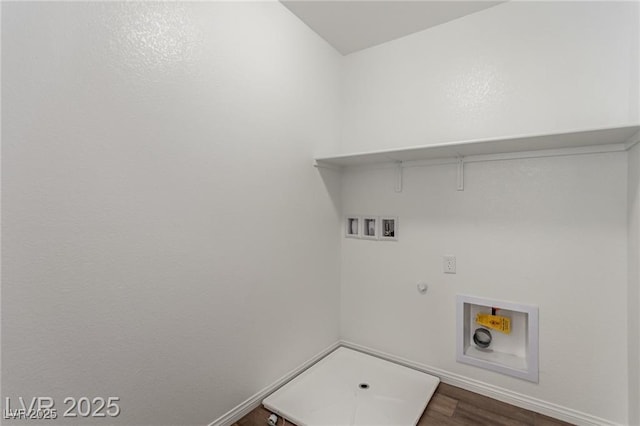 clothes washing area featuring baseboards, washer hookup, laundry area, gas dryer hookup, and dark wood-type flooring