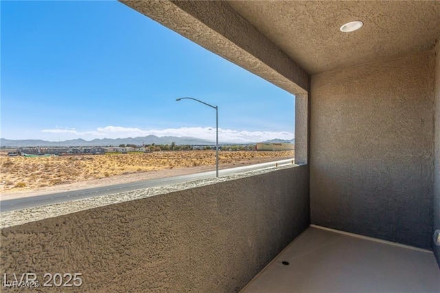 balcony featuring a mountain view