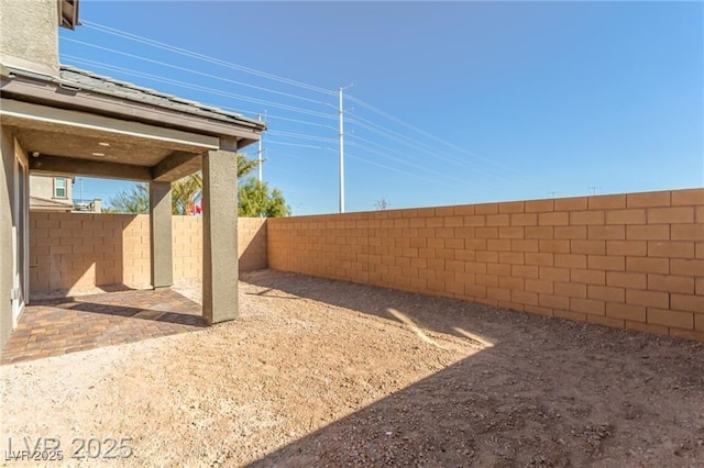view of yard with a patio and a fenced backyard
