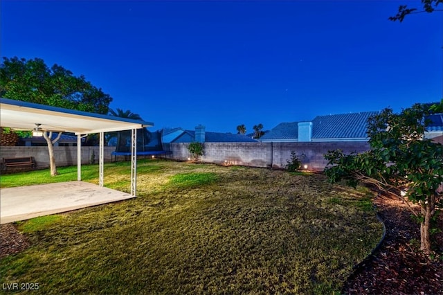 view of yard featuring a patio and a fenced backyard