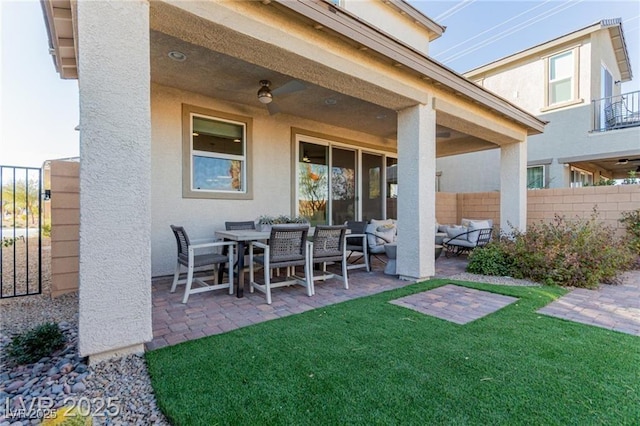 view of patio featuring an outdoor hangout area and fence