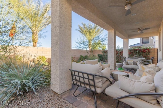 view of patio / terrace featuring a fenced backyard, ceiling fan, and an outdoor hangout area
