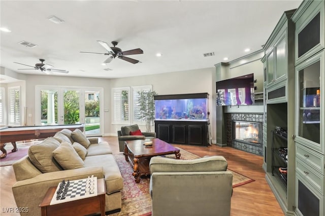 2338 Dolphin Ct, Henderson, NV 89074 - living area featuring a fireplace, light wood finished floors, a ceiling fan, billiards table, and recessed lighting