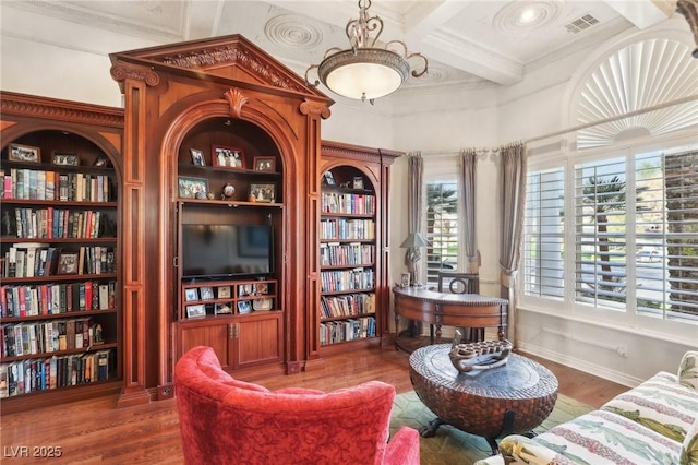 2338 Dolphin Ct, Henderson, NV 89074 - sitting room featuring ornamental molding, coffered ceiling, wood finished floors, beam ceiling, and built in shelves