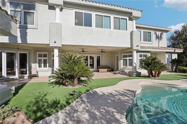 2338 Dolphin Ct, Henderson, NV 89074 - back of property with stucco siding, a patio, a ceiling fan, and a tile roof