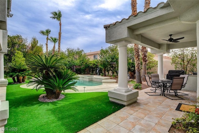 view of patio / terrace featuring ceiling fan