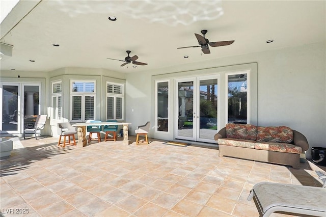 view of patio with a ceiling fan and french doors