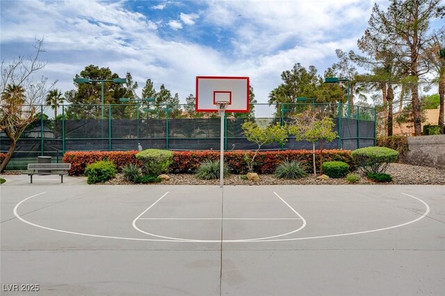 view of basketball court featuring fence and community basketball court