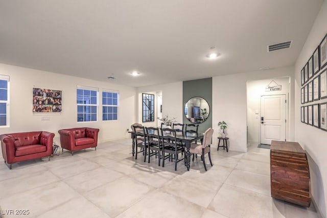 dining room featuring baseboards, visible vents, and recessed lighting