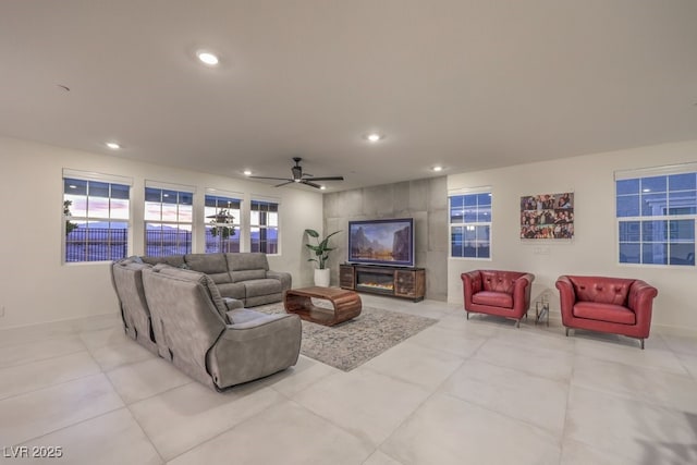 living room with light tile patterned floors, recessed lighting, and ceiling fan