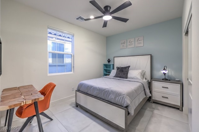 bedroom with ceiling fan, baseboards, light tile patterned flooring, and visible vents