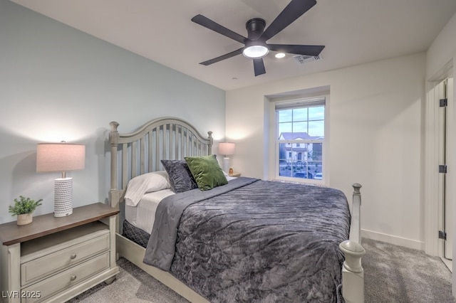 carpeted bedroom featuring baseboards, visible vents, and ceiling fan