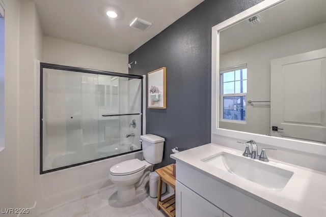 full bathroom featuring visible vents, toilet, enclosed tub / shower combo, and vanity