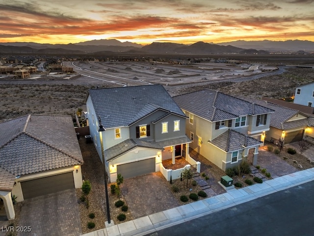 view of front facade featuring stucco siding and a mountain view