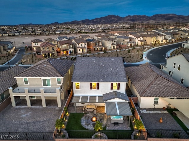 drone / aerial view featuring a mountain view and a residential view