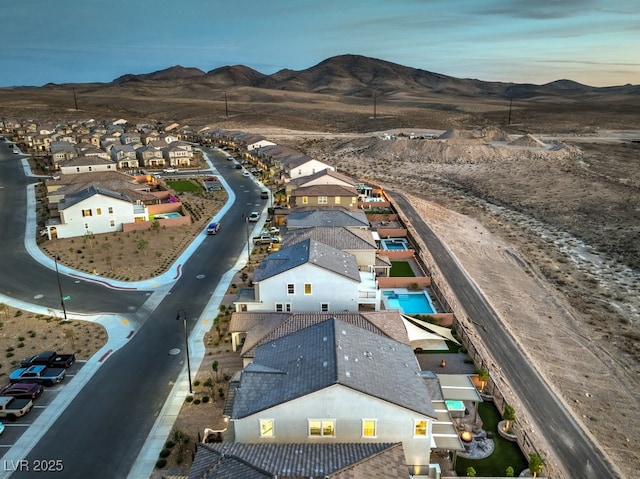 aerial view featuring a mountain view and a residential view