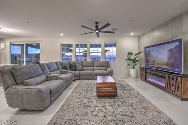 living area featuring a ceiling fan, visible vents, and recessed lighting
