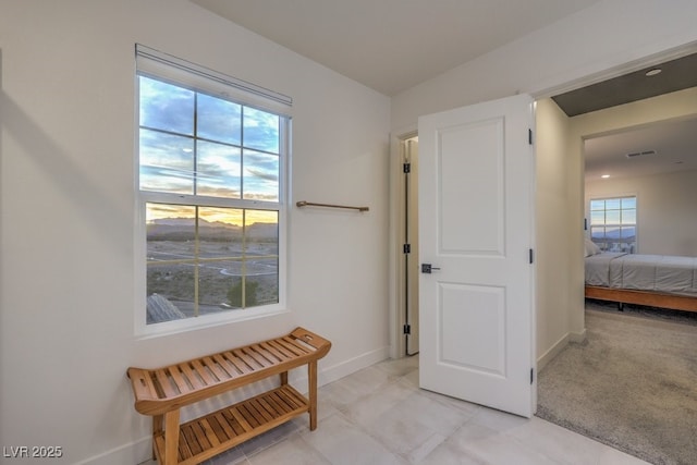 bedroom with visible vents and baseboards