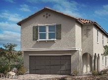 view of front of property with a garage, driveway, and stucco siding