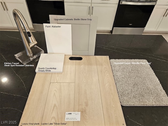 interior space featuring white cabinetry and range