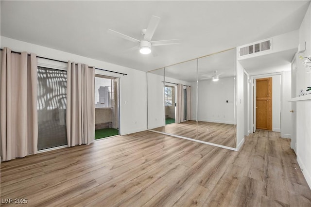 3425 E Russell Rd Unit 155, Las Vegas, NV 89120 - unfurnished bedroom with a ceiling fan, baseboards, wood finished floors, visible vents, and a closet