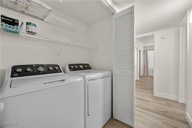 3425 E Russell Rd Unit 155, Las Vegas, NV 89120 - laundry area featuring independent washer and dryer, laundry area, baseboards, and light wood finished floors