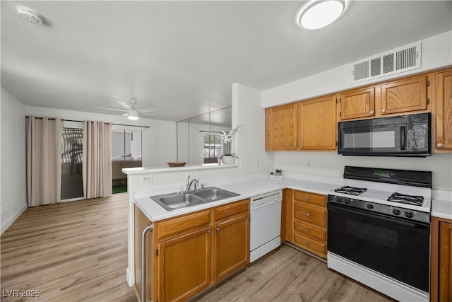 3425 E Russell Rd Unit 155, Las Vegas, NV 89120 - kitchen featuring visible vents, black microwave, gas range, a sink, and dishwasher