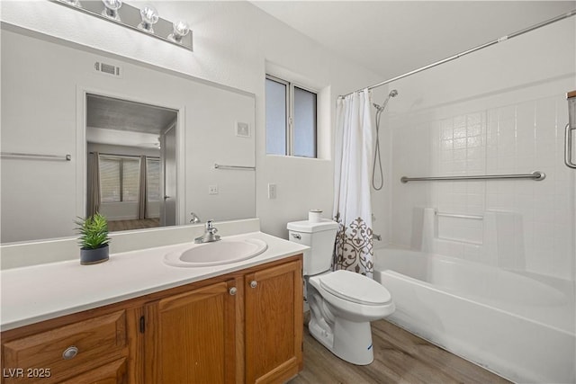 3425 E Russell Rd Unit 155, Las Vegas, NV 89120 - bathroom featuring visible vents, wood finished floors, vanity, toilet, and shower / tub combo with curtain