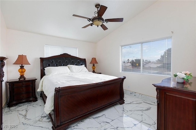bedroom with marble finish floor, ceiling fan, multiple windows, and vaulted ceiling