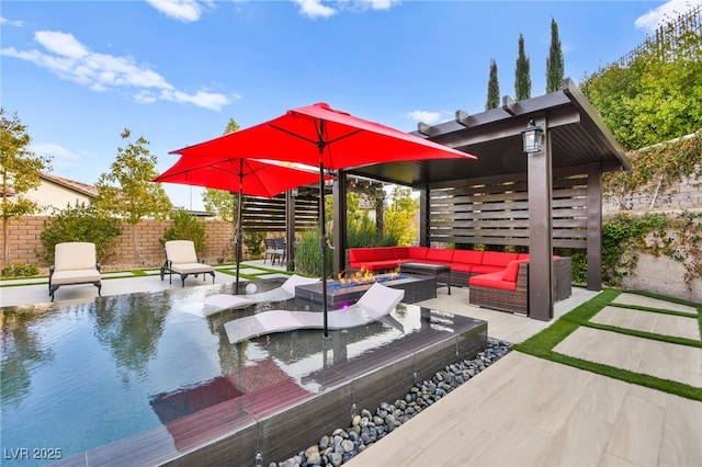 view of patio / terrace with fence and an outdoor living space with a fire pit