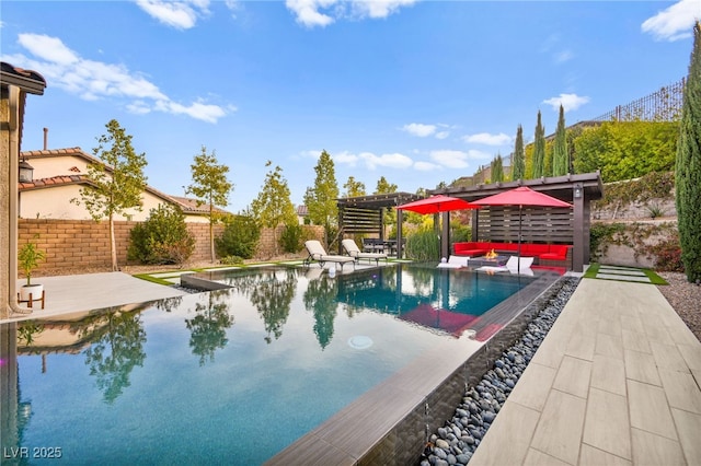 view of pool with a fenced in pool, a fenced backyard, outdoor lounge area, and a patio area