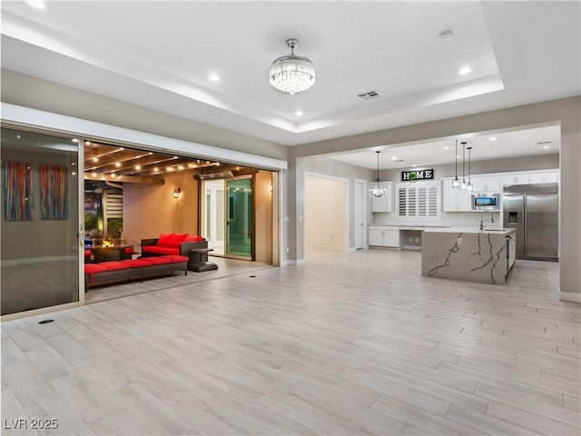 interior space featuring visible vents and a sink