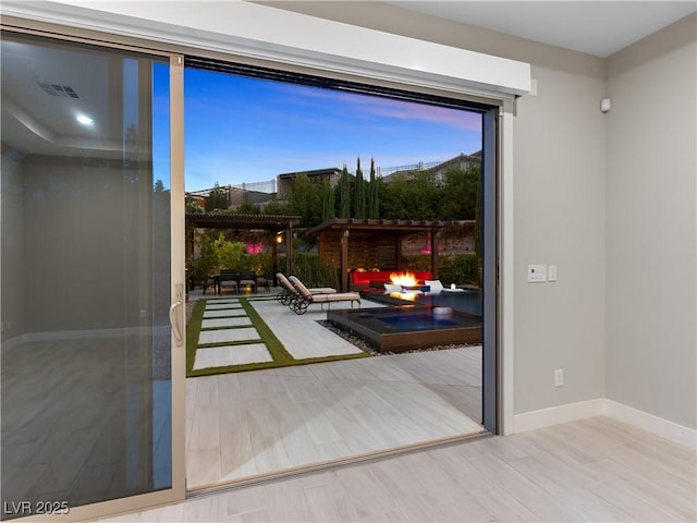 entryway with baseboards and visible vents