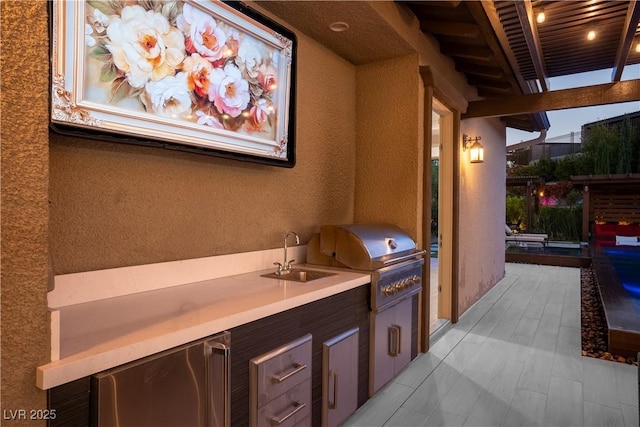 exterior space with a sink and area for grilling