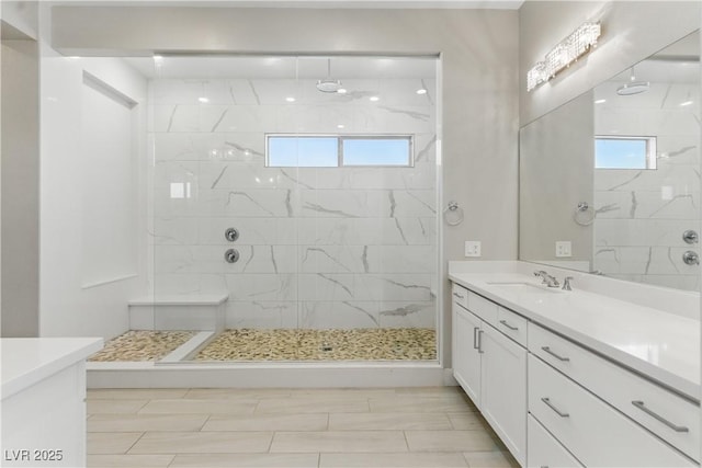 bathroom featuring vanity and a tile shower