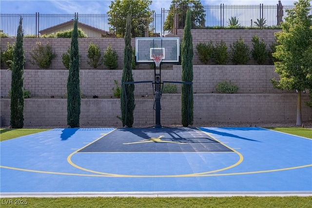 view of sport court with fence and basketball court