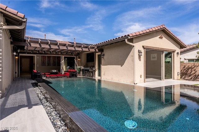 12119 Castilla Rain Ave, Las Vegas, NV 89138 - outdoor pool featuring exterior kitchen, a pergola, and a patio