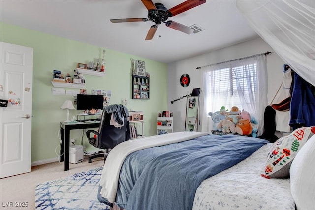 carpeted bedroom featuring visible vents, a ceiling fan, and baseboards
